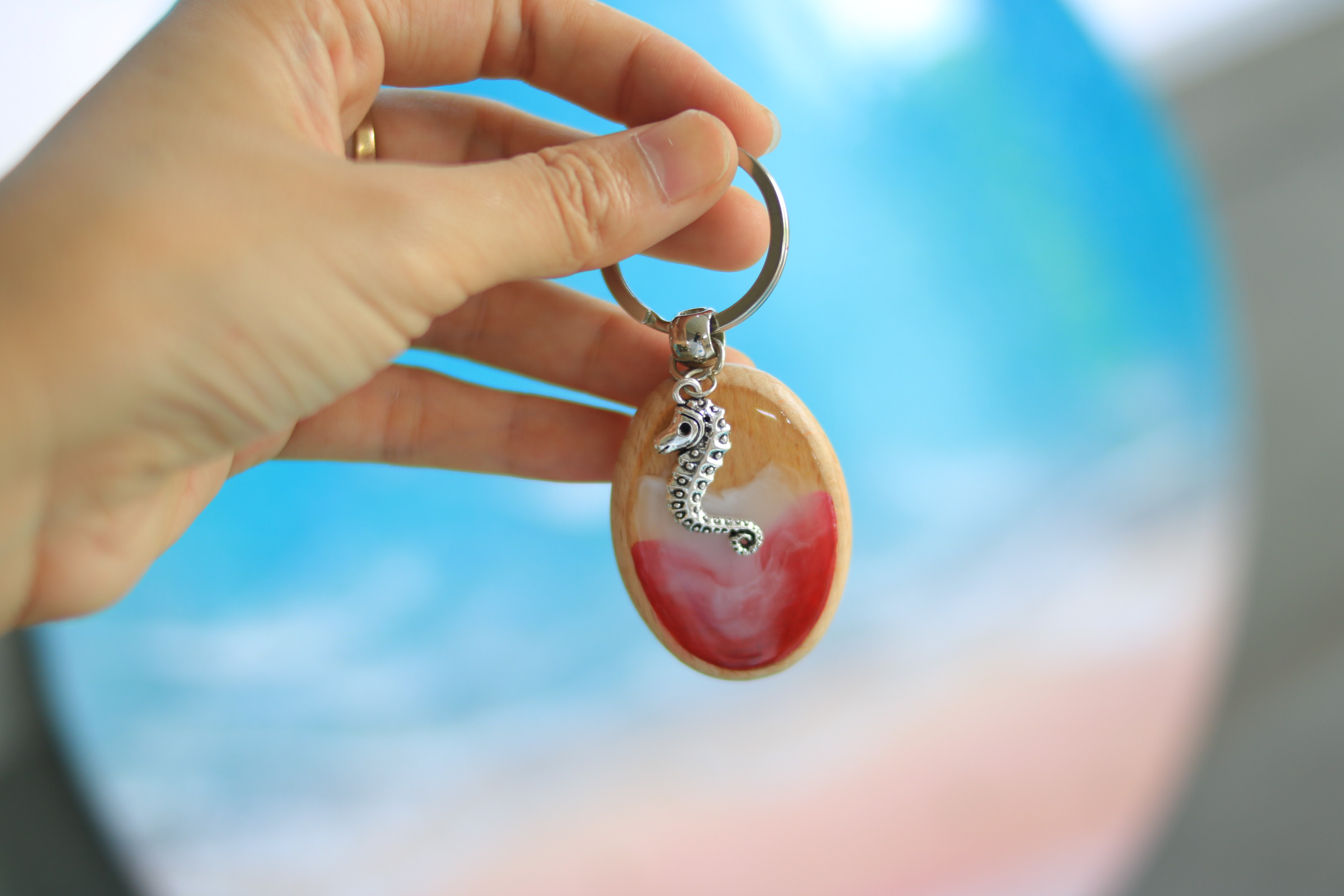 Handmade Wooden & Resin Keychain – Red & White Swirl with Seahorse Charm